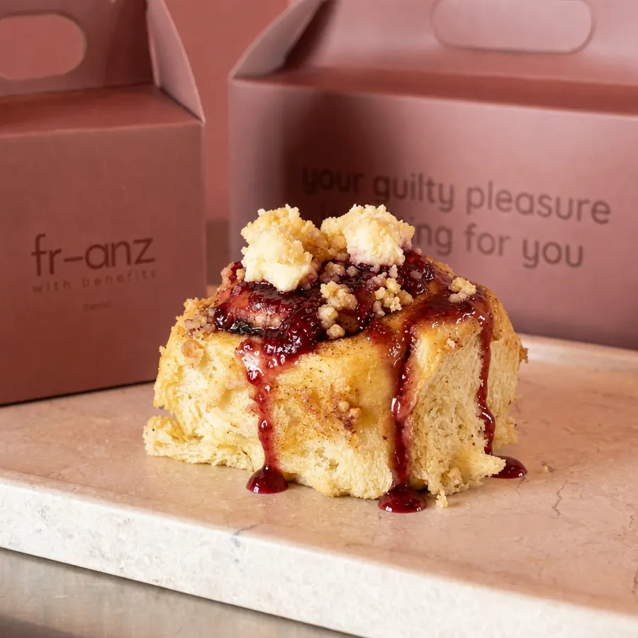 Strawberry cheesecake cinnamon roll with strawberry compote