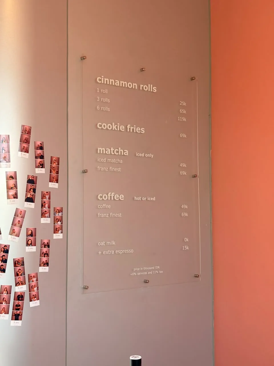 The menu on our wall, next to the wall of photobooth strips