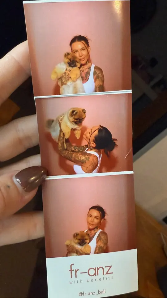 A photobooth strip of a guest with her dog